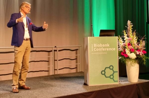 Professor Arno Pelotie on stage presenting at the Nordic Biobank Conference